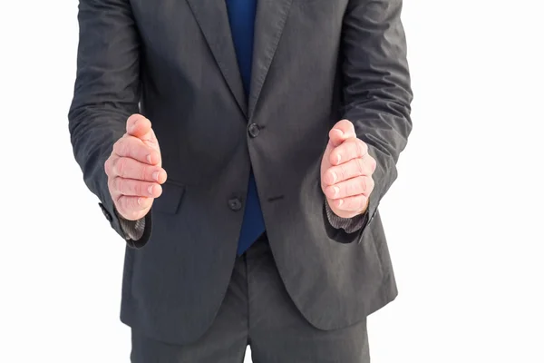 Businessman standing with hands out — Stock Photo, Image