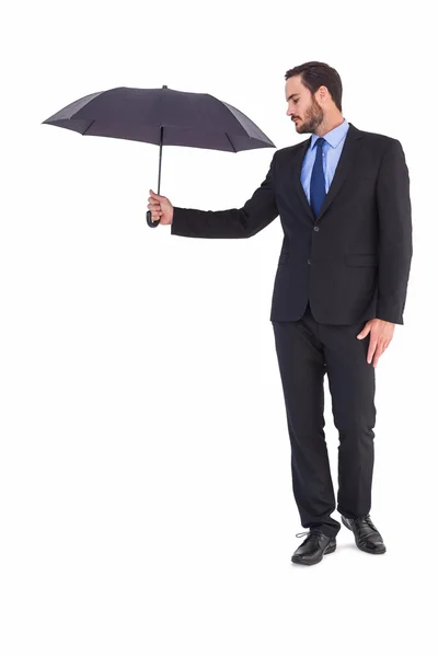 Businesswoman in suit holding umbrella — Stock Photo, Image