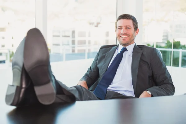 Relaxed businessman with his feet up — Stock Photo, Image