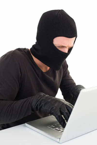 Hacker using laptop to steal identity — Stock Photo, Image