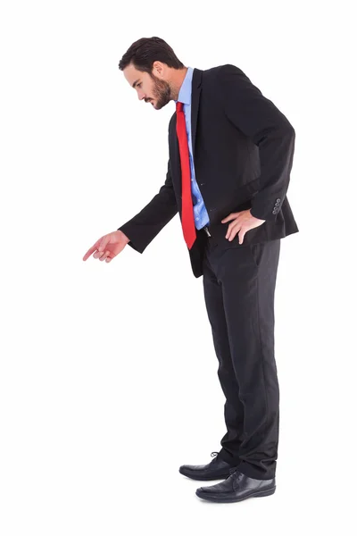 Affärsman i kostym pekar finger — Stockfoto
