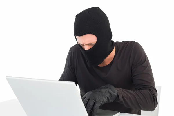 Hacker using laptop to steal identity — Stock Photo, Image