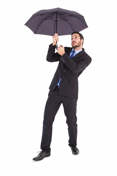 Businesswoman in suit holding umbrella — Stock Photo, Image