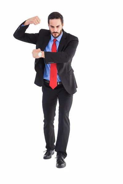 Focused businessman holding something with his hands — Stock Photo, Image