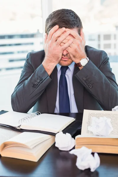 Stressed businessman with head in hands — Stock Photo, Image