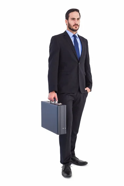 Focused businessman holding a briefcase — Stock Photo, Image