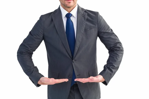 Businessman standing with hands out — Stock Photo, Image