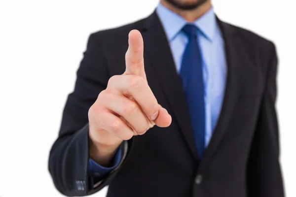 Businessman pointing his finger at camera — Stock Photo, Image