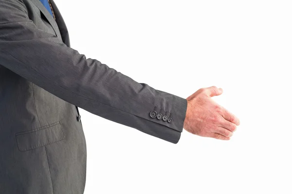 Businessman holding his hand out — Stock Photo, Image