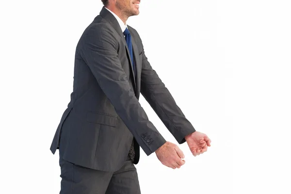Affärsman håller något med sina händer — Stockfoto