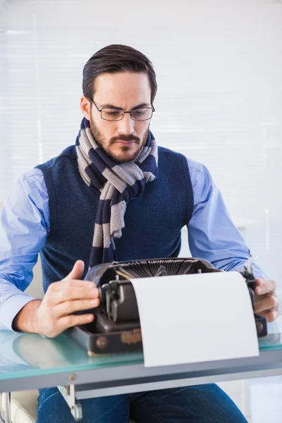 Serious businessman working on typewriter — Stock Photo, Image