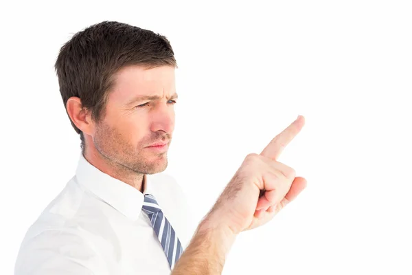 Businessman pointing with his finger Stock Picture