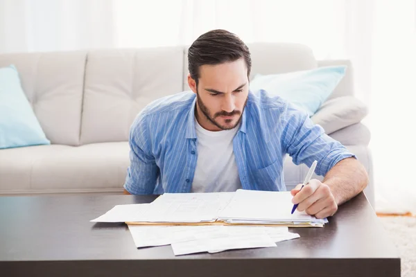 Focused man paying his bills Royalty Free Stock Images