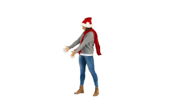 Pretty brunette in santa hat walking and presenting with hand — Stock Video