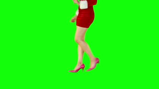 Sexy girl in santa outfit walking and turning — Stock Video