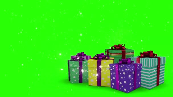 Regalos de Navidad que aparecen sobre fondo verde — Vídeo de stock