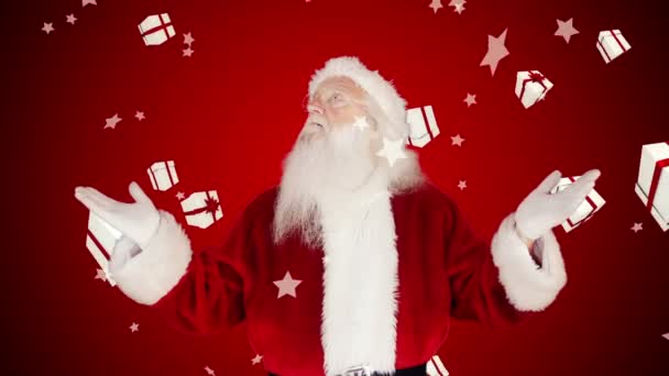 Santa, zvyšování rukou proti padající vánoční dárky — Stock video