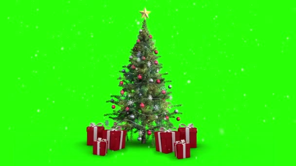 Снег падает на елку и подарки — стоковое видео