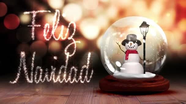 Boneco de neve dentro do globo de neve com saudação de Natal em espanhol — Vídeo de Stock