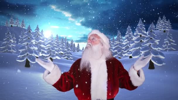 Santa att höja händerna mot snöiga fir skog — Stockvideo