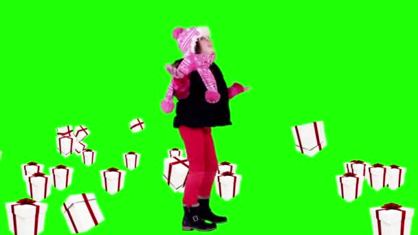 Festive little girl under falling christmas gifts — Stock Video