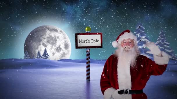 Santa viftande vid nordpolen — Stockvideo