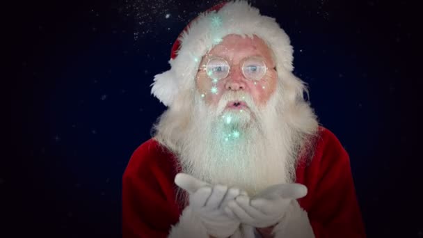 Weihnachtsmann bläst glitzernden Weihnachtsgruß — Stockvideo