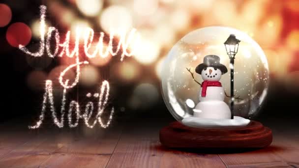 Muñeco de nieve dentro de bola de nieve con saludo mágico en francés — Vídeo de stock