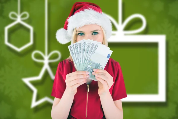 Pretty blonde in red dress showing her cash — Stock Photo, Image