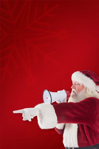 Weihnachtsmann zeigt auf etwas — Stockfoto