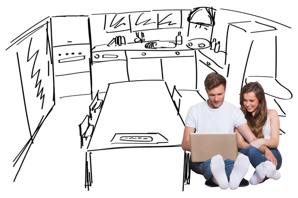 Couple using laptop on floor — Stock Photo, Image