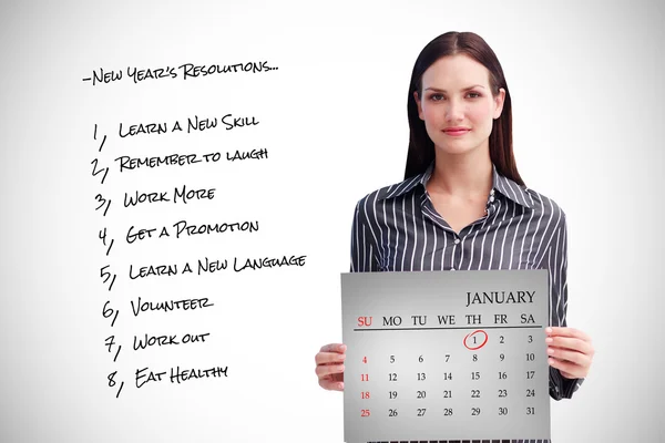 Empresária segurando um calendário — Fotografia de Stock