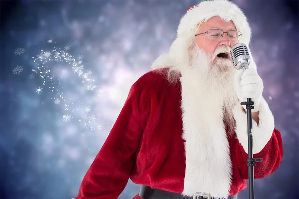 Santa Claus śpiewa kolędy — Zdjęcie stockowe