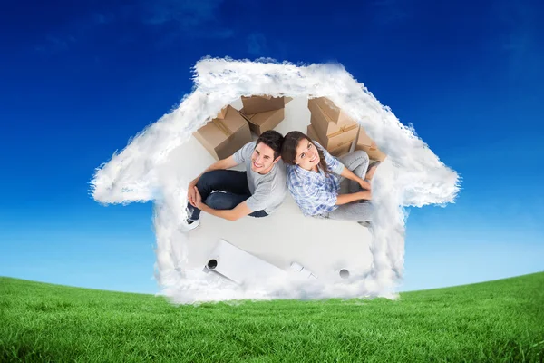 Overview of a happy couple sitting back-to-back — Stock Photo, Image