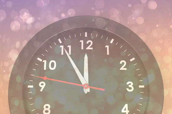 Composite image of clock counting down to midnight — Stock Photo, Image