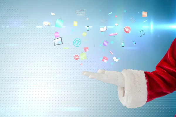 Композитное изображение Санта-Клауса, представленное рукой — стоковое фото