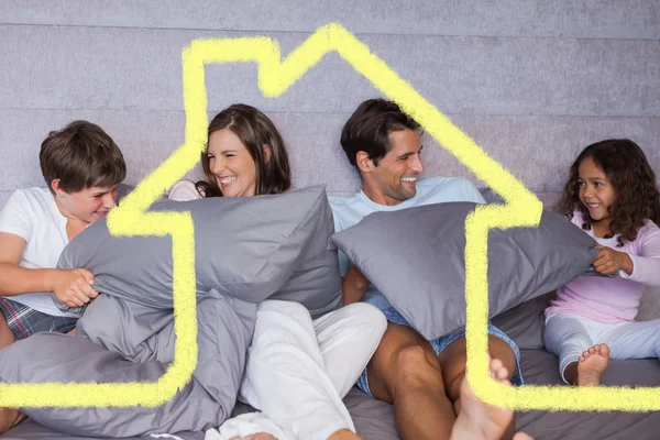 Family having fun together on bed — Stock Photo, Image