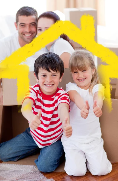 Aile kutuları ve başparmak ile ev taşıma — Stok fotoğraf