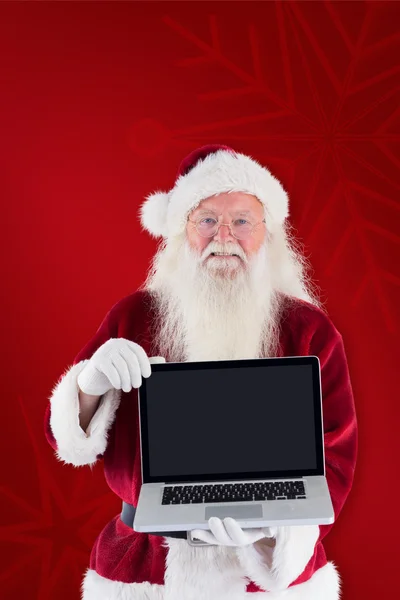 Santa Claus presenterar bärbara — Stockfoto