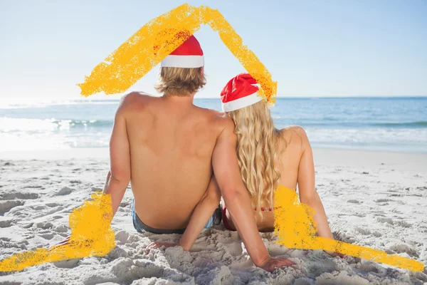 Rear view of couple sitting on beach — Stock Photo, Image