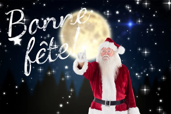 Santa claus points at something — Stock Photo, Image