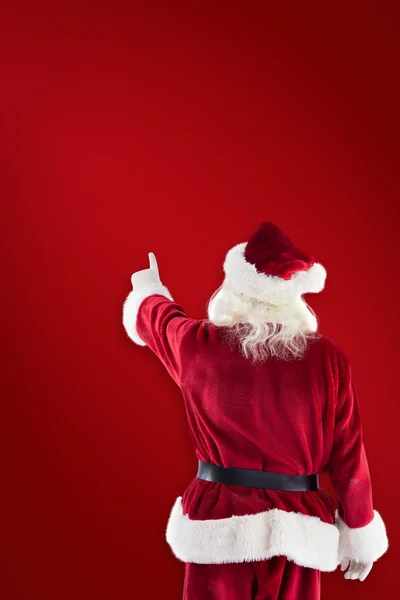Papai Noel aponta para algo — Fotografia de Stock