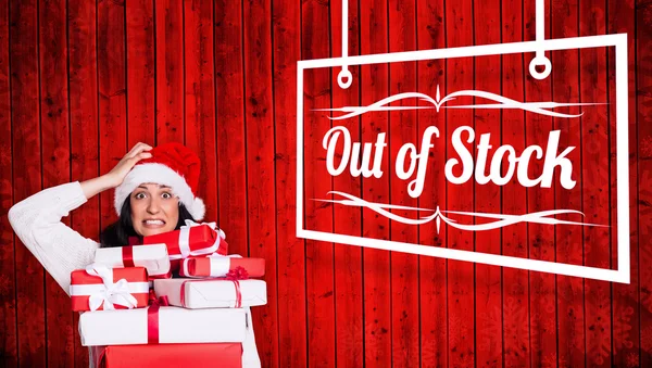 Shocked woman with christmas presents — Stock Photo, Image