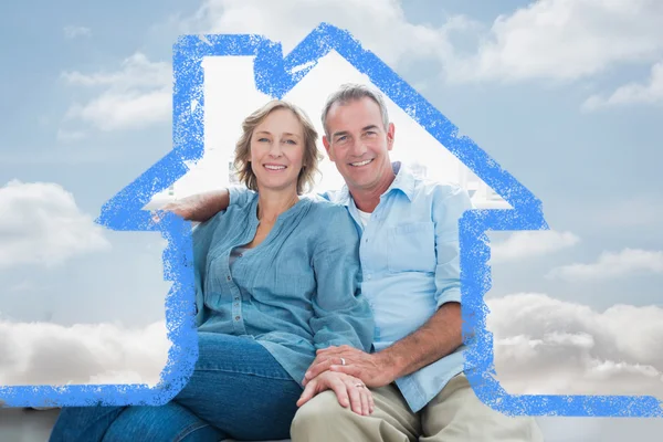 Middle aged couple relaxing on the couch — Stock Photo, Image