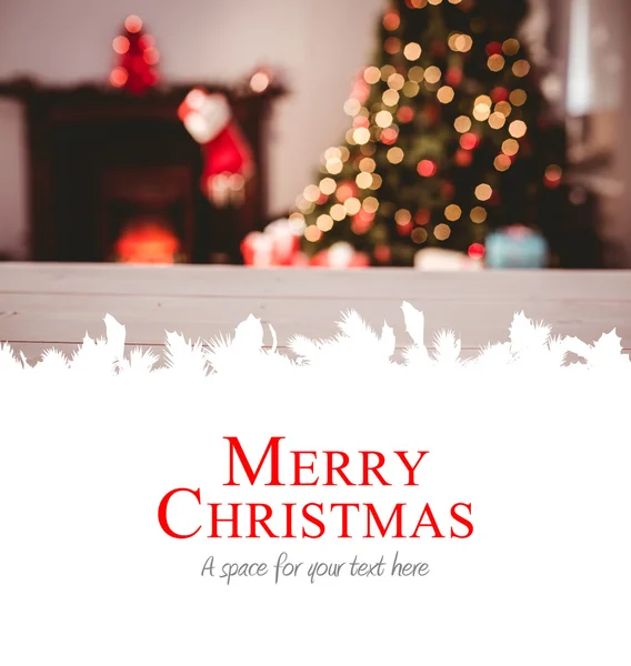 Merry christmas against christmas tree — Stock Photo, Image