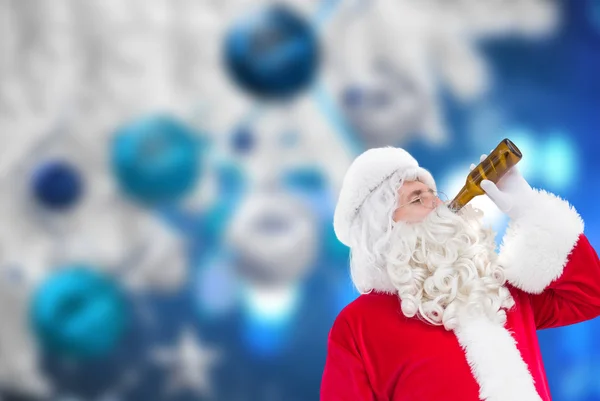 Father christmas drinking a beer — Stock Photo, Image