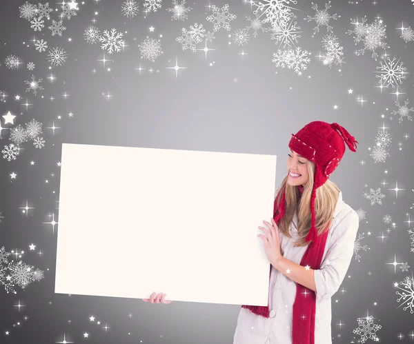 Pretty blonde showing white poster — Stock Photo, Image