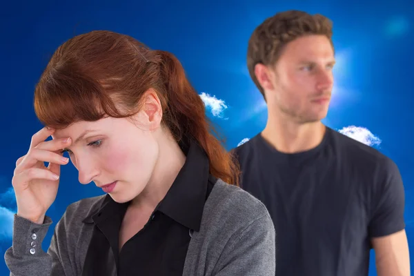 Worried woman with man behind — Stock Photo, Image