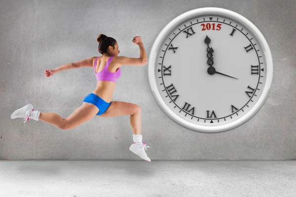 Composite image of fit brunette running — Stock Photo, Image