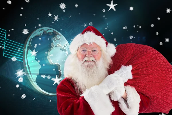 Jolly Santa carries his sack — Stock Photo, Image